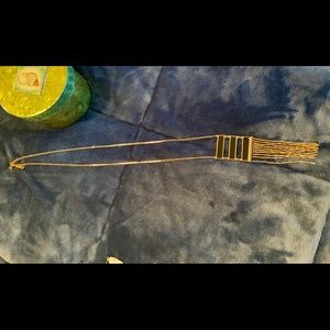 21" neckleaa in gold with blacl enamal filled in 3 spaces.new